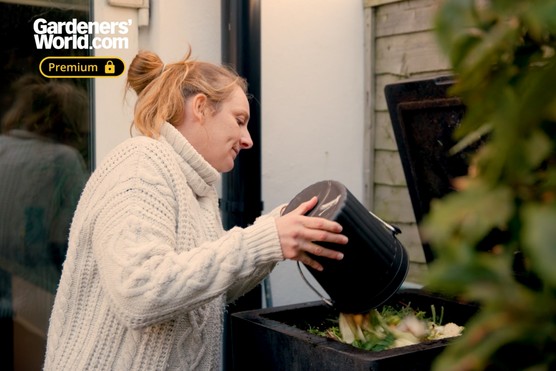 Kate Bradbury putting vegetable scraps in hotbin