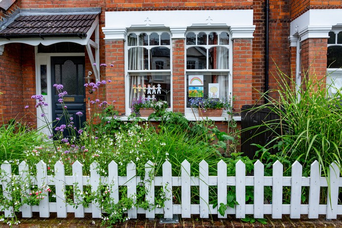 Picket fencing with colourful planting. Paul Debois