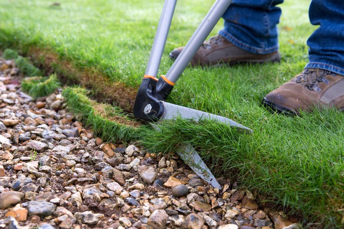 Edging a lawn with lawn shears