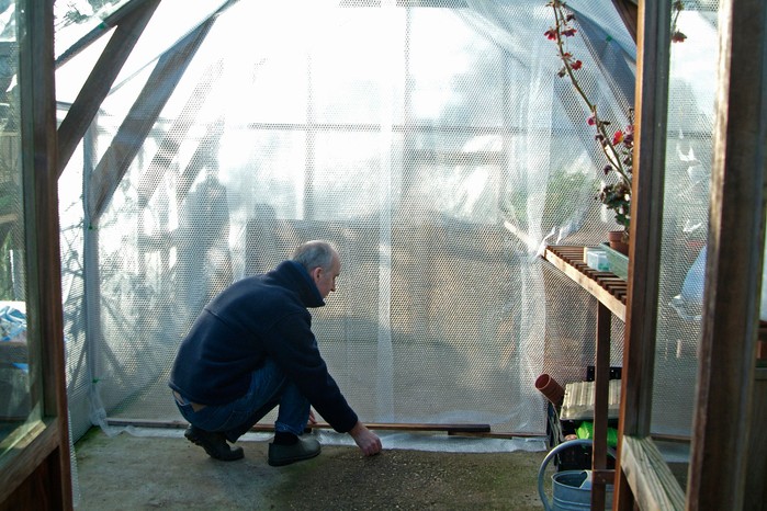 Creating a bubble-wrap curtain to divide a greenhouse