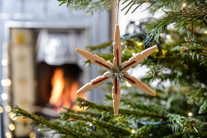 Christmas tree with fire in the background