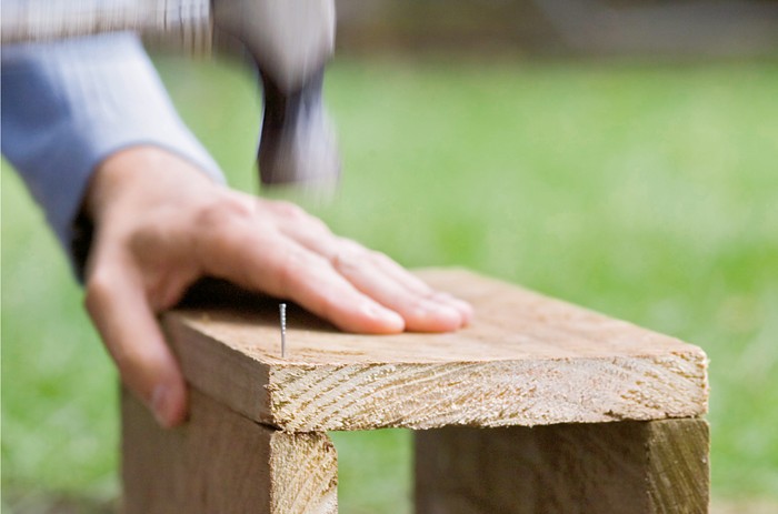 How to make a hedgehog house - nailing the timber pieces together